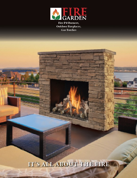 Stone outdoor fireplace on a patio with cushioned seating and a glass-top table; sunset over a waterfront view.